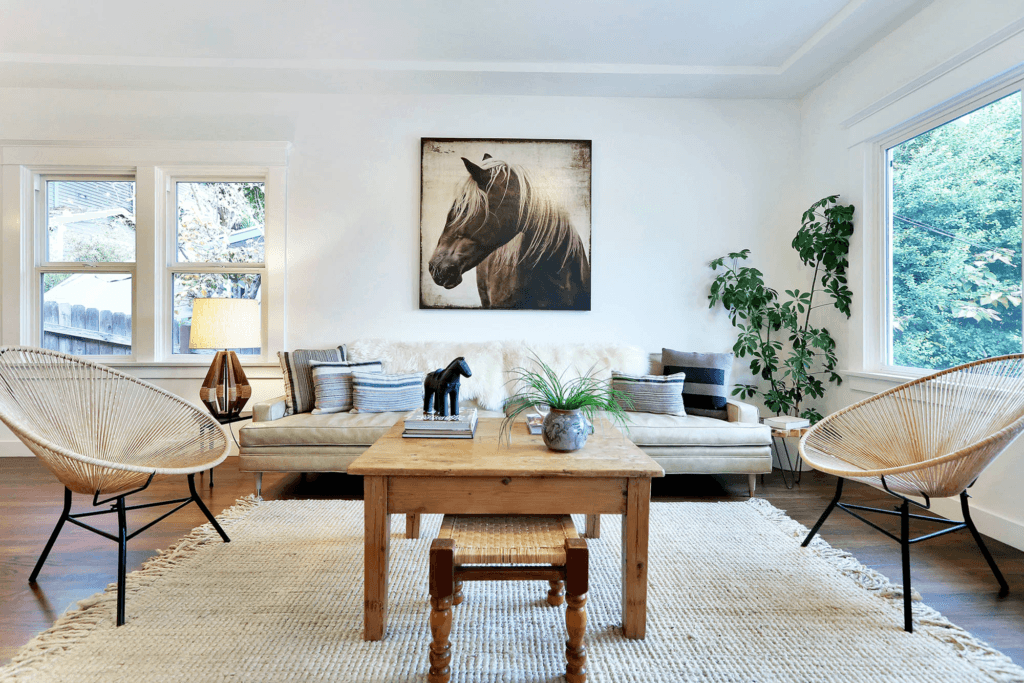 Coastal Hamptons interior design styles highlighting crisp white upholstery and abundant natural light