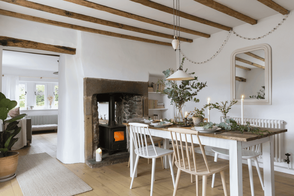 Cozy Cottage interior design style displaying floral patterns, vintage beadboard walls, and distressed painted furniture
