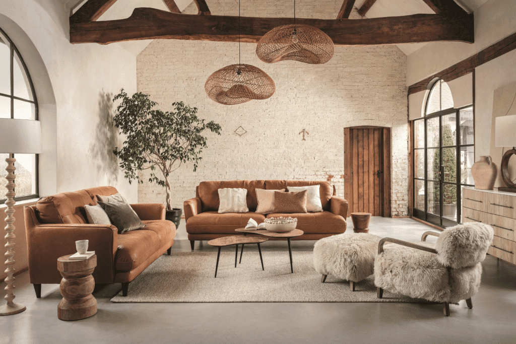 Eclectic Bohemian interior design styles showing textured macrame wall hangings, lush indoor plants, and layered rug