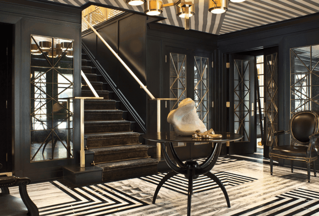 Glamorous Art Deco interior design styles highlighting bold geometric patterns, luxurious velvet seating, and polished gold fixtures