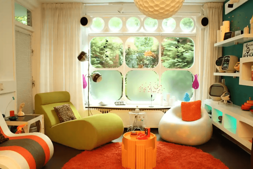 Nostalgic Retro interior design style highlighting mid-century modern shapes, bold orange and teal colors, and vintage appliances
