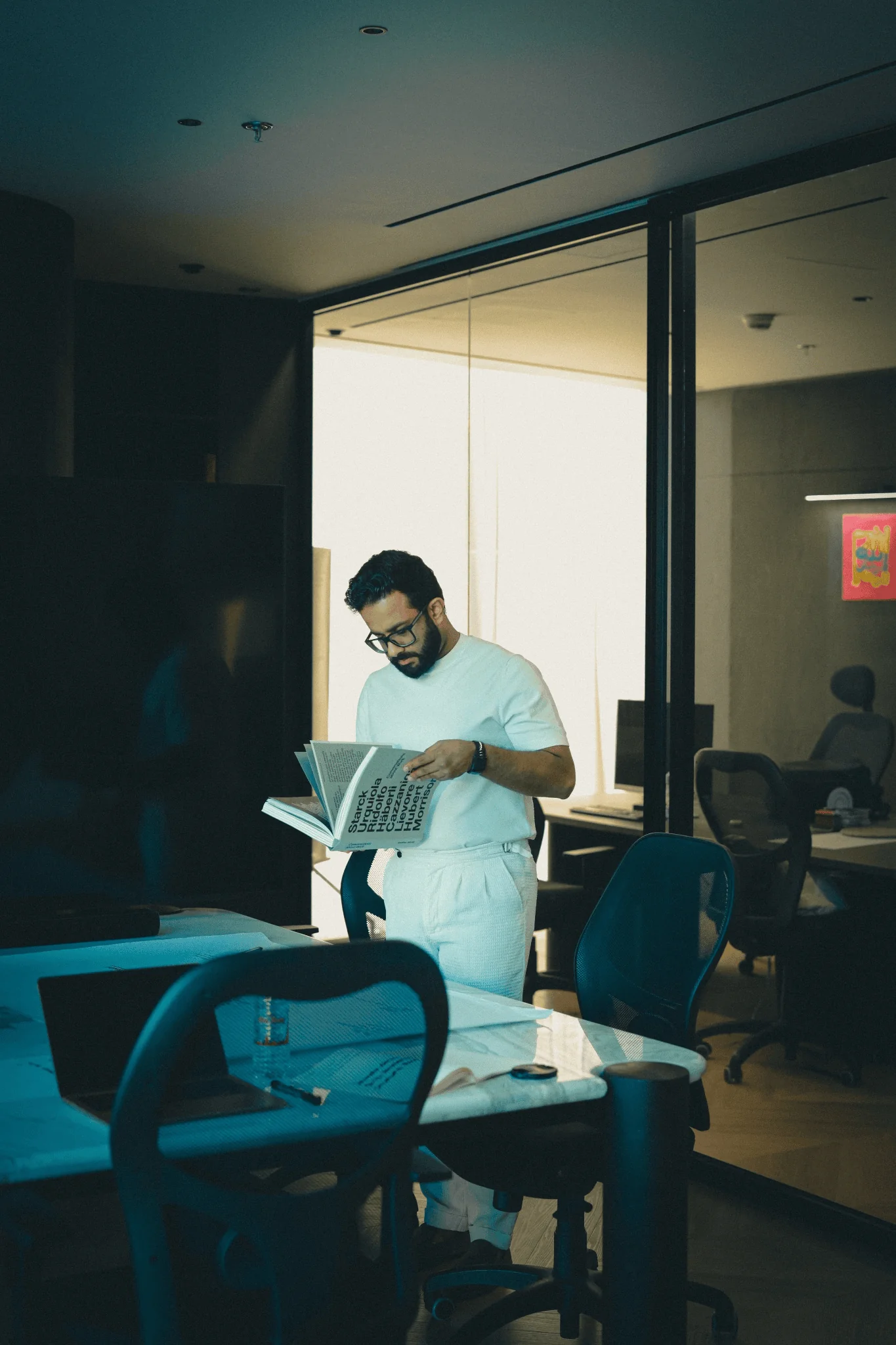 zahir interior design consultant reviewing a unit on a laptop in dubai
