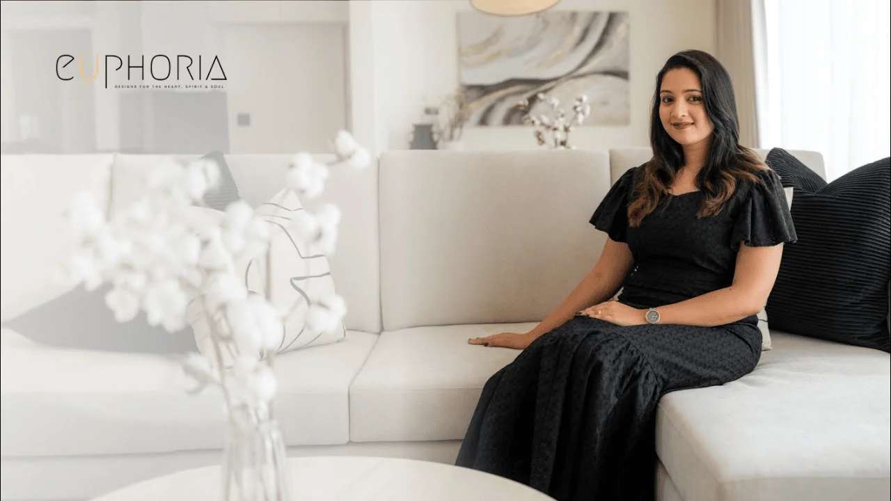 amanda dsouza interior designer in dubai seated in a euphoria interiors living room