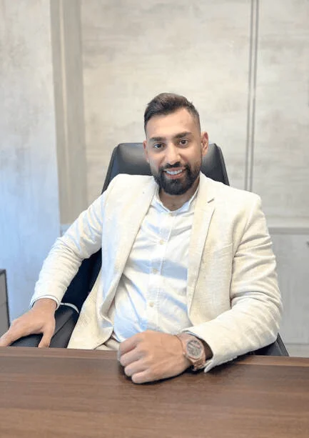 mustafa misto interior designer in dubai seated in his studio
